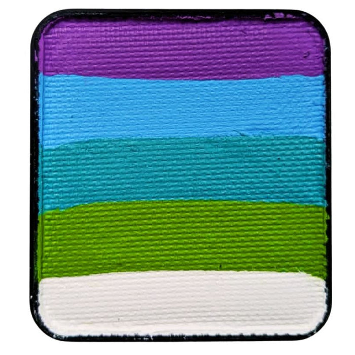 Rainbow cake with purple blues teal and green 