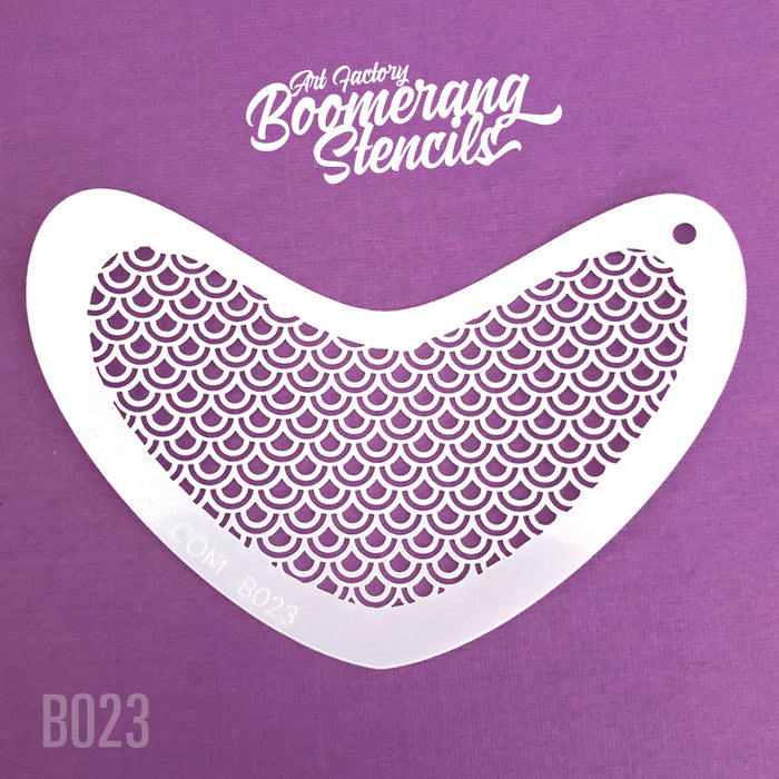 Boomerang-shaped stencil with a peacock feather pattern on a purple background