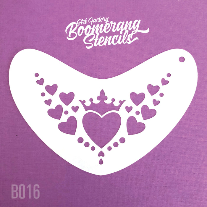 A white boomerang-shaped stencil with heart and crown designs on a purple background