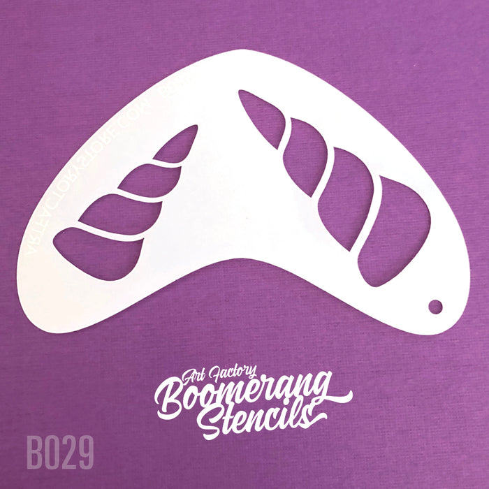 A white unicorn horn boomerang shaped stencil on a purple background